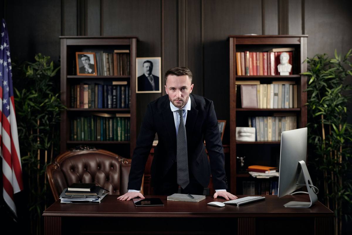 A partner at work in book-lined chambers